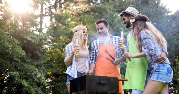 istock Friends making barbecue and having lunch 968996210