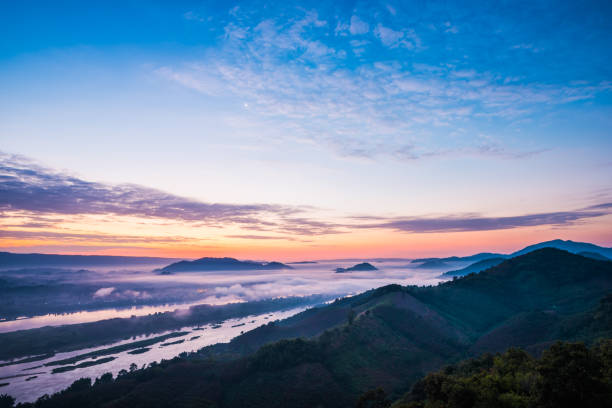 istock Sunrise and the mist in winter morning 968998444