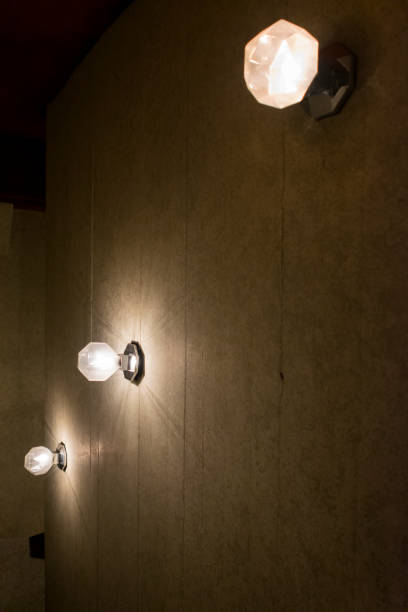 istock Energy saving light bulb in hanging lamp in Guatemala, central America. 969005202