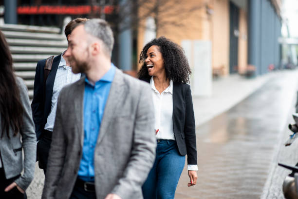 istock Businesspeople walking and talking outdoors 969013780