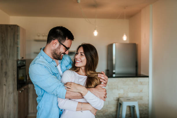 istock Couple hugging and looking at each other. 969013996