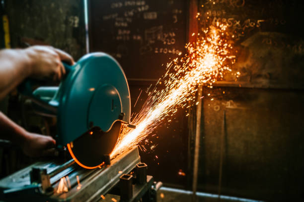 istock Cutting a metal with mitre saw with sharp circular blade. 969015302
