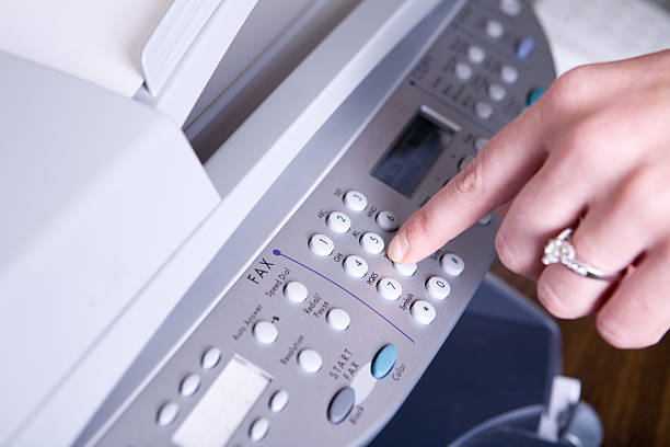 Old fax machine close up, on a white background.  office equipment