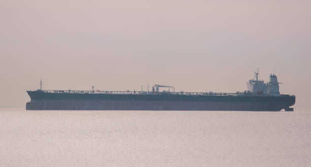 istock breakwater, and ships on the horizon. 969031348