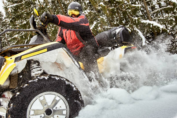 istock Winter race on an ATV on snow in the forest. 969035676