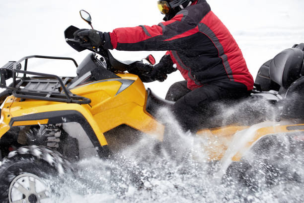 istock Winter race on an ATV on snow in the forest. 969035686
