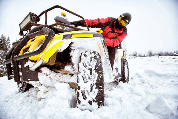 istock Winter race on an ATV on snow in the forest. 969035688