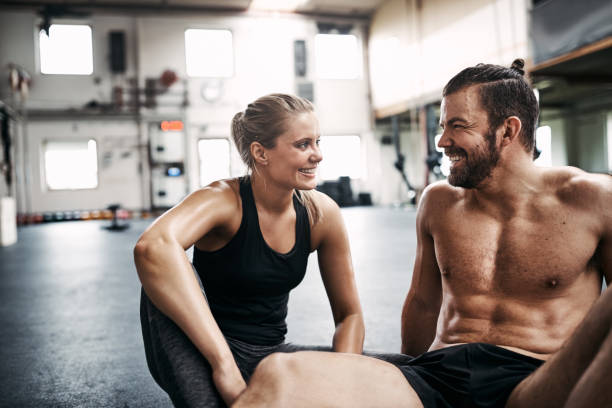 istock Smiling young couple taking a break from working out together 969035886