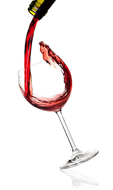 istock Red wine is poured into a falling glass 96903932