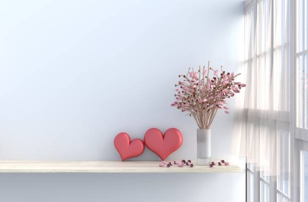 Grey-White living room decor with two hearts ,white wall, window, table, pink rose,vase, drape, curtain,The sun shines through the window. 3d render.For valentine day.