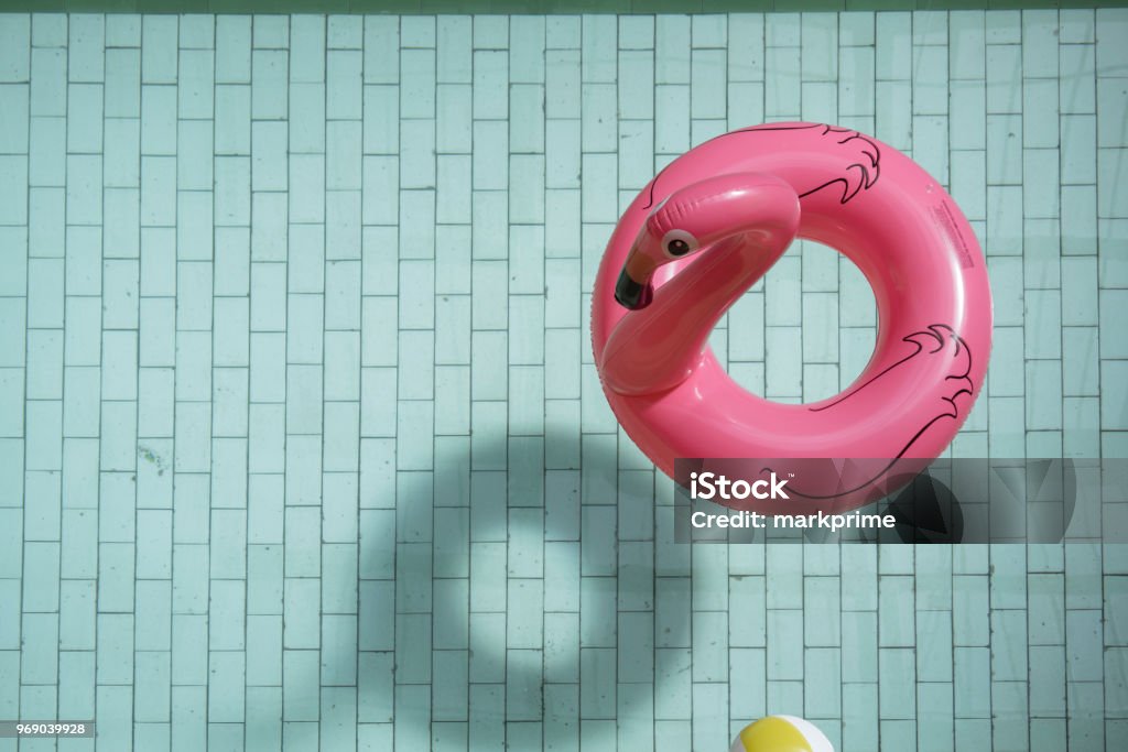 A flamingo ring A float in a sun lit pool at the Victoria Baths, Manchester. Beach Ball Stock Photo