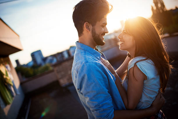istock Beautiful couple hugging and smiling 969048910