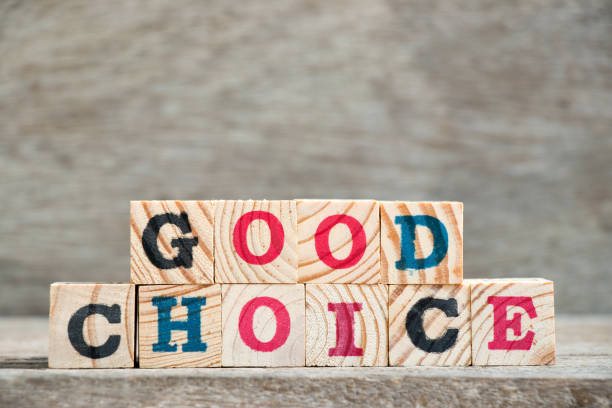 istock Letter block in word good choice on wood background 969049582