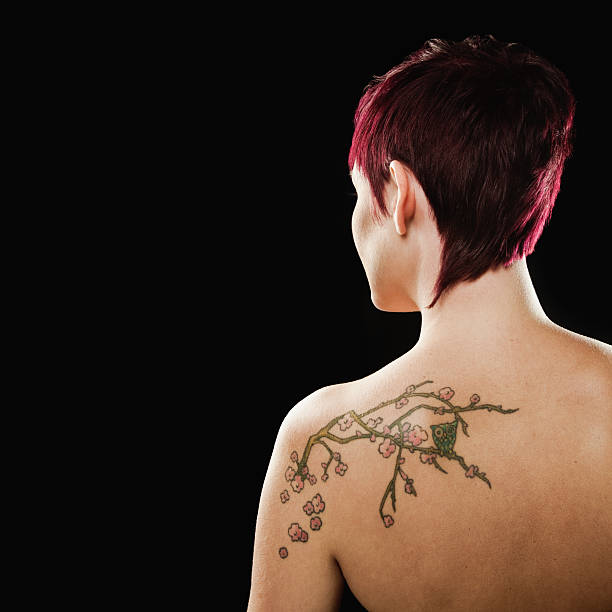 Portrait of Woman With Tattoo on Back stock photo