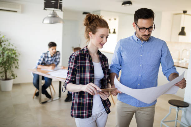 istock Image of business partners discussing documents and ideas 969052534