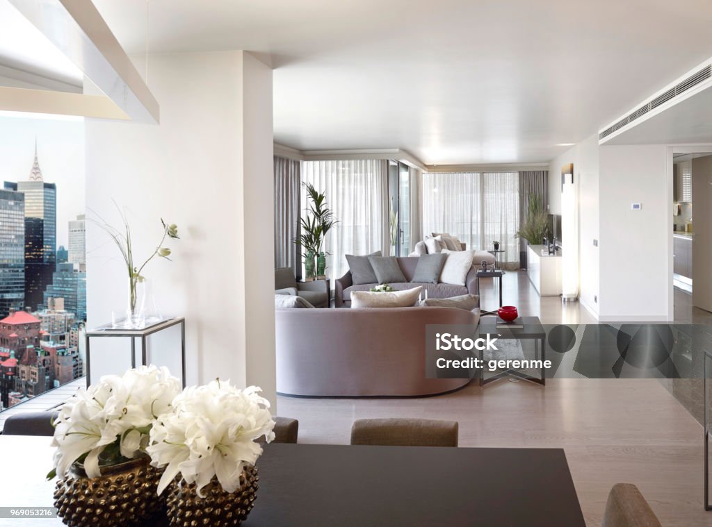 Luxury living room Wide angle shot of a luxury apartment and the balcony New York City Stock Photo