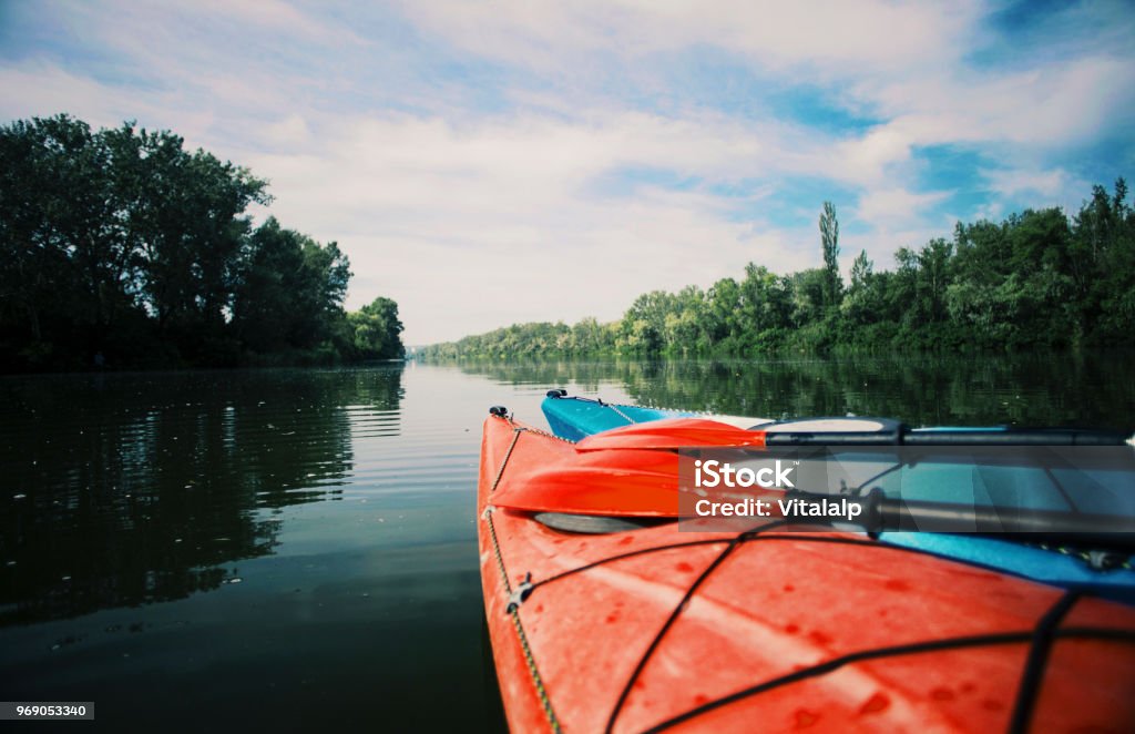 Kayaking on the Lake Concept Photo. Sport Kayak on the Rocky Lake Shore. Close Up Photo. Kayak Stock Photo