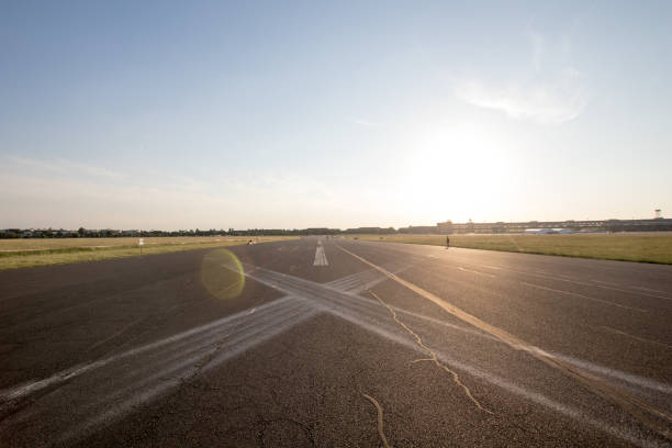 Road in perspective in the plain with horizontal signs to X.