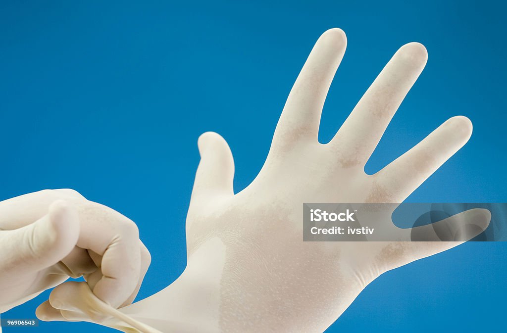 I guanti chirurgici - Foto stock royalty-free di Guanto da chirurgo