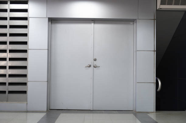 istock sidewalk by street wall & door 969071758