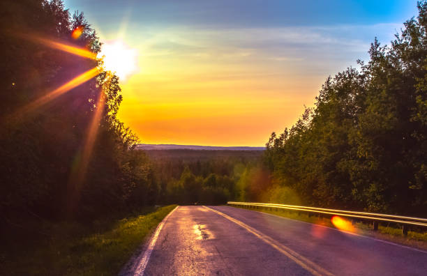 Summer night road view from Sotkamo, Finland.