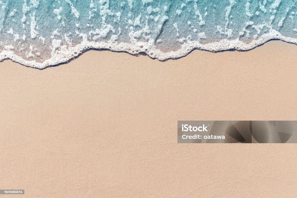Soft wave lapped the sandy beach, Summer Background. Beach Stock Photo