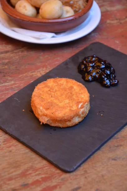 istock Brie cheese baked with breadcrumbs. Served with cranberry marmalade. 969093636