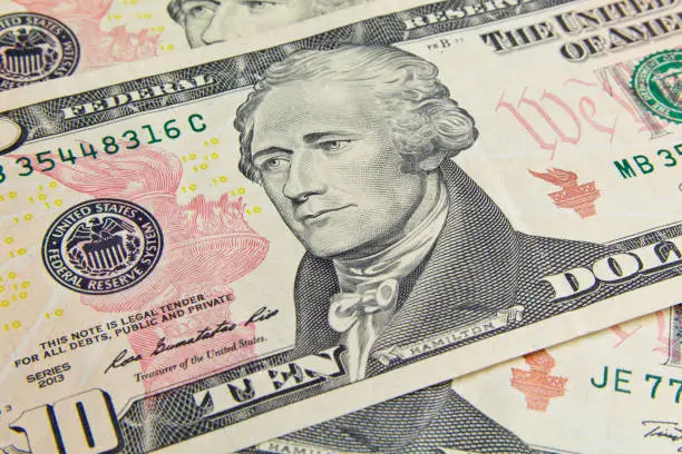Photo of Front of the ten dollar bill with a Portrait of President Alexander Hamilton close-up