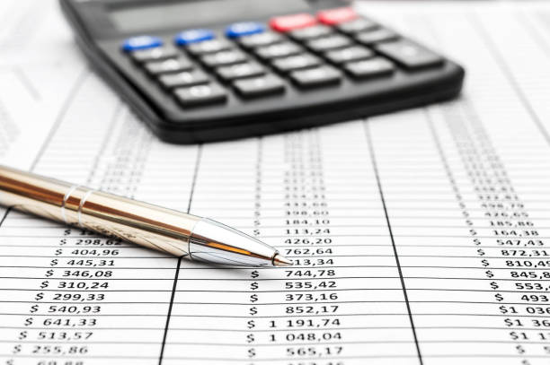 istock Pen with calculator on document with financial data. Business concept. 969107130