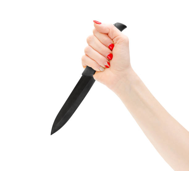 istock Woman hand holding knife. Isolated on white. 969111302