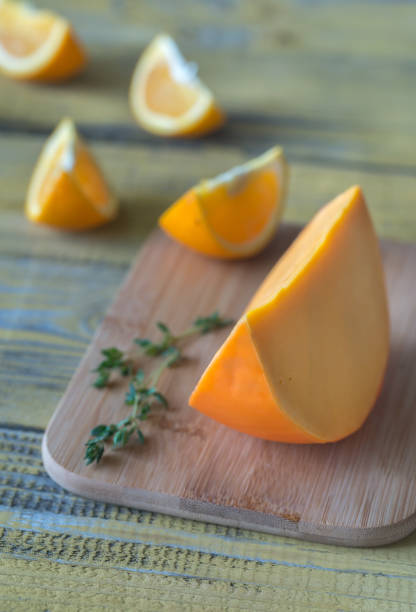 istock Mimolette cheese on the wooden board 969115426