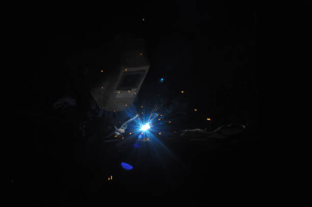 istock Welder welding metal in workshop with sparks 969115798