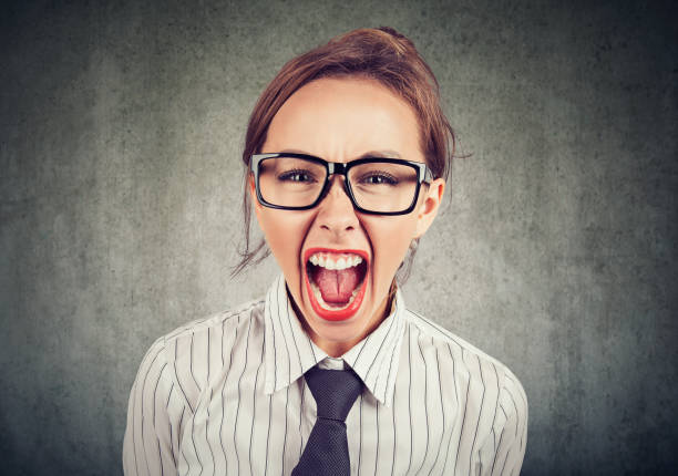 istock Screaming young woman in glasses 969123774