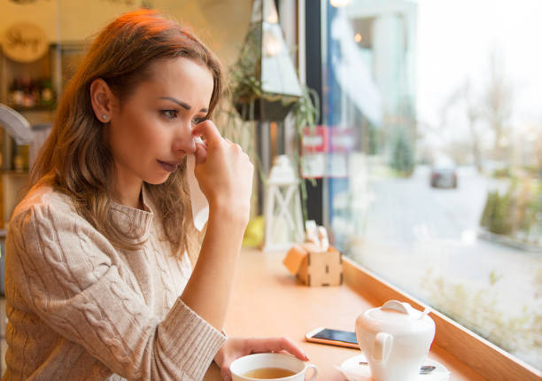 istock Crying woman in cafeteria 969126166