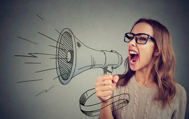 istock Woman shouting in megaphone 969126178