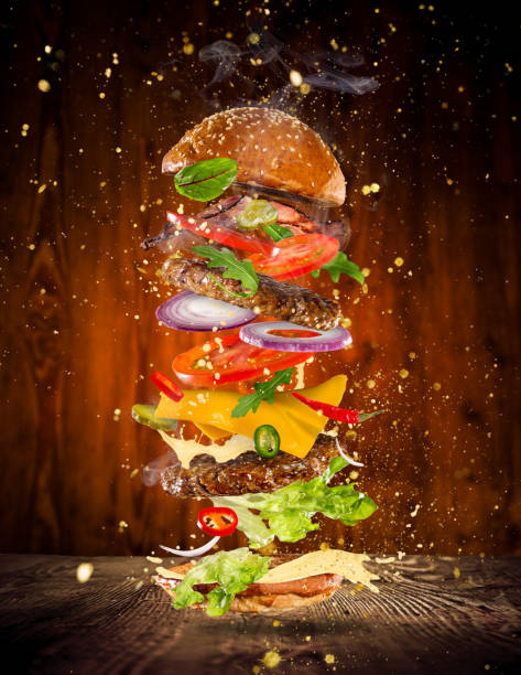 istock Big tasty burger with flying ingredients 969126202