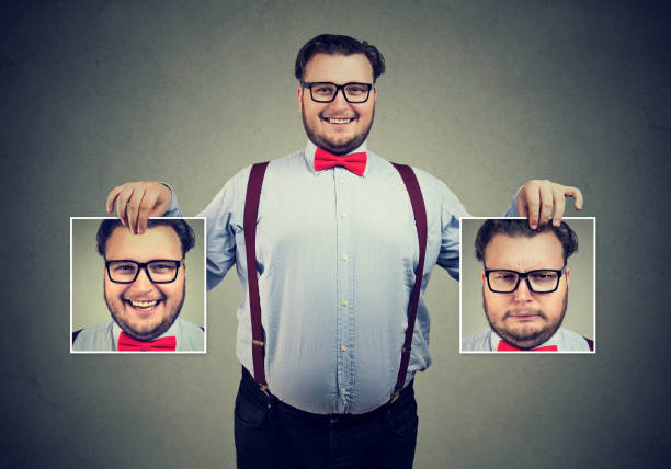 istock Cheerful man showing different photos with emotions 969126226