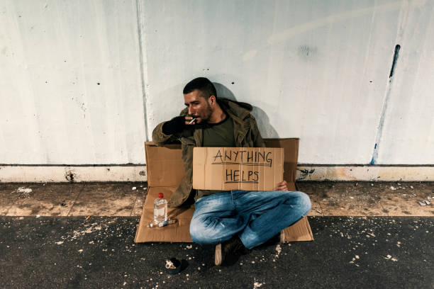 istock Homeless person begging for food or help 969126984