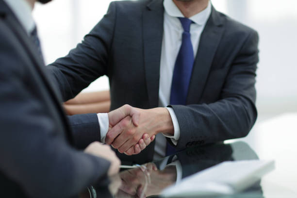 istock close up. handshake business people 969129956