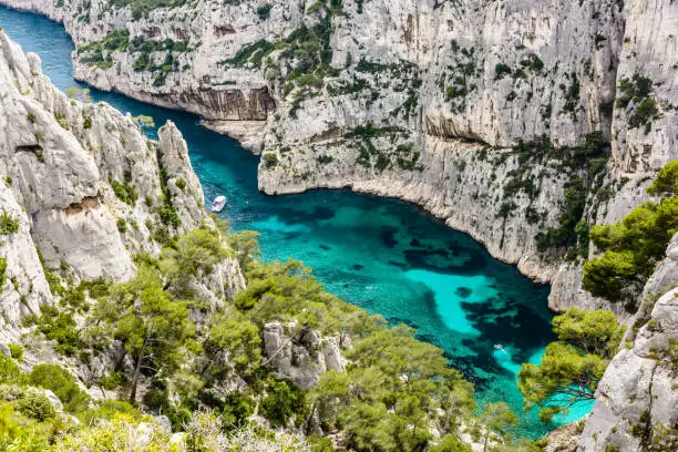 View from above of the calanque of En-Vau, a hard-to-reach natural creek with crystal clear water on the french mediterranean coast, part of the Calanques National Park between Marseille and Cassis.