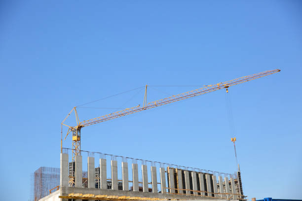istock A construction crane is a tool for carrying large building materials to high heights. 969136456
