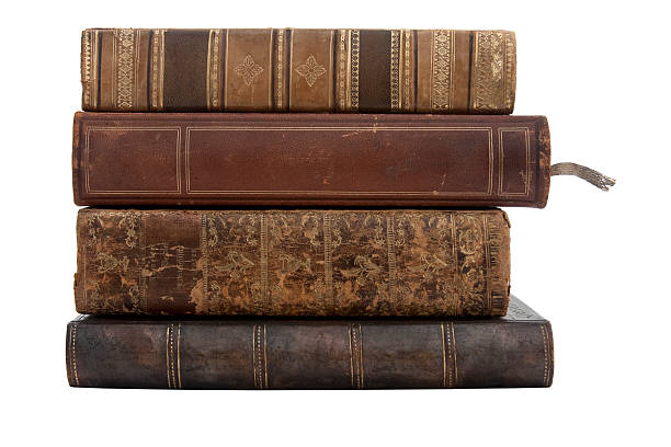 A stack of old antique books on a white background