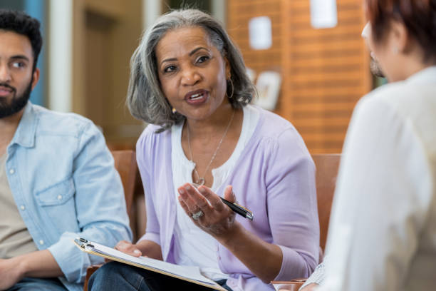 istock Mental health professional leads support group 969143826