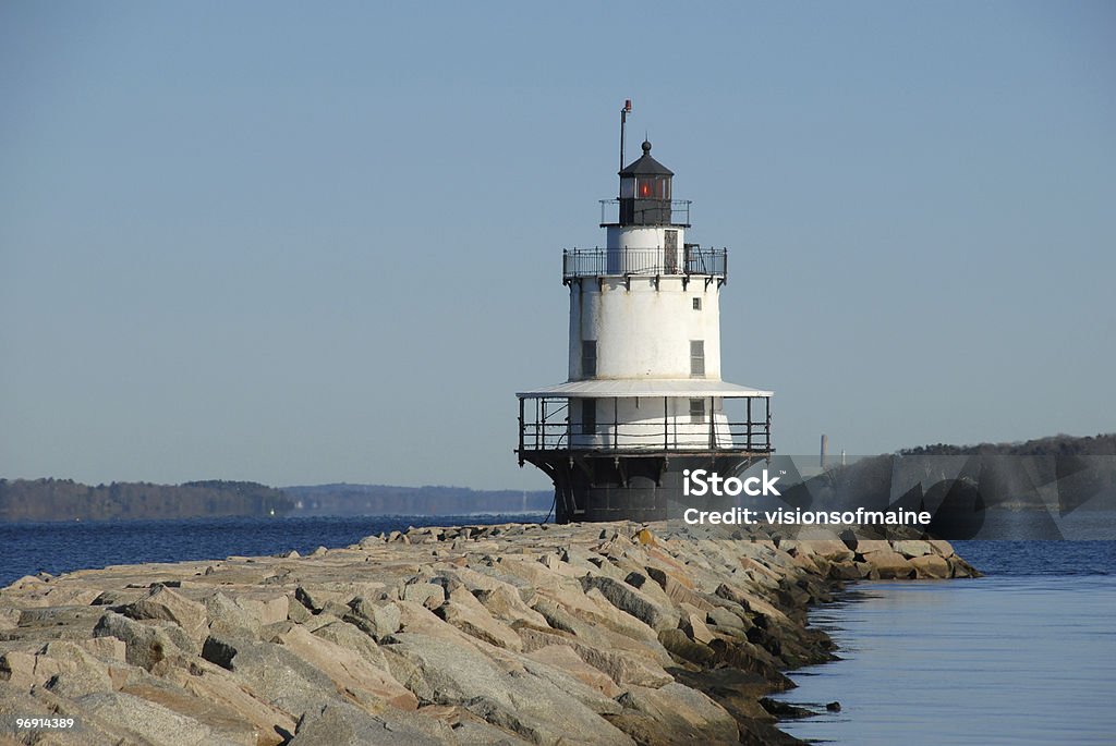 New England lighthouse flashes a red signal  Beacon Stock Photo