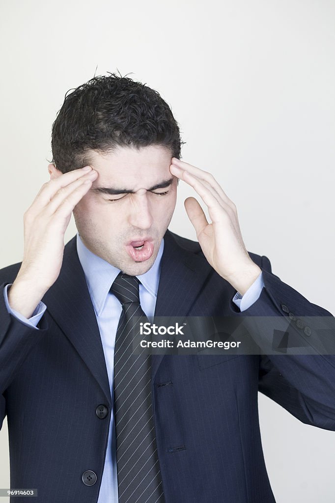 businessman with headache businessman having headache Adult Stock Photo