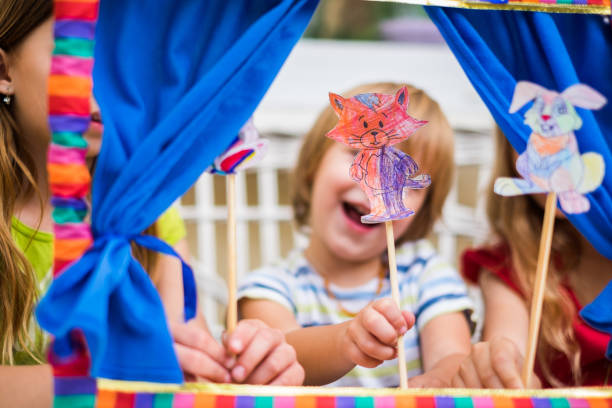 istock Kids at the puppet show at home 969155428