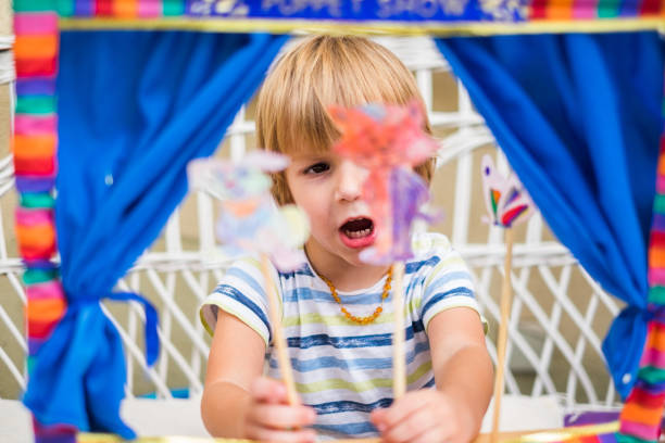 istock Cute little boy playing with puppet 969155844