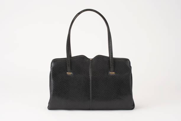 istock BLACK CROCODILE SKIN HANDBAG ISOLATED ON WHITE BACKGROUND 969156074
