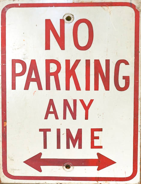 A No Parking Anytime Sign with arrows