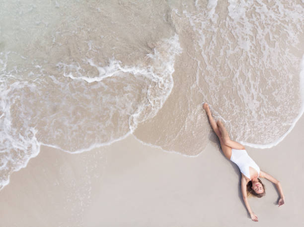 istock Woman Lying On a Beach 969159718